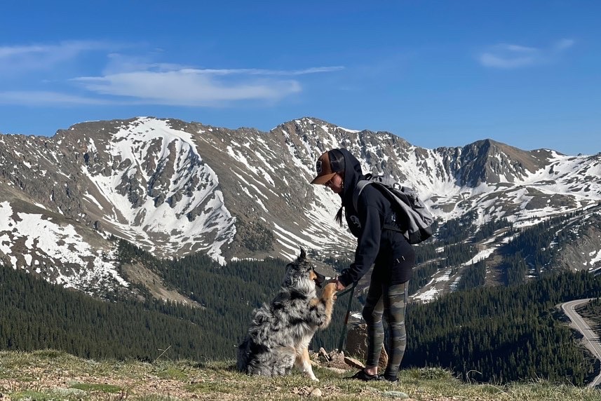Lenka Robitaille with her dog in the mountains